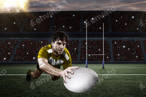 Preview: Rugby Player In A Yellow Uniform Scoring On A Stadium.
