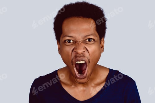 Preview: Portrait Of Afro American Man Screaming At Camera On Studio.