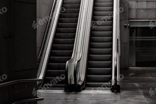 Preview: A Grayscale Shot Of Escalators In A Building At Daylight