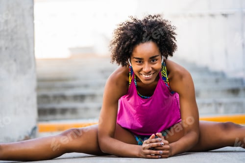 Preview: Afro Athlete Woman Stretching Legs Before Exercise.