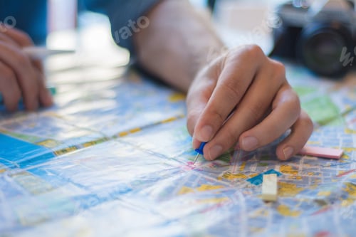 Preview: Young Man Planing A Trip. Hand On Pointing Blue Pin Plan To Travel On Map. Travel Concept.