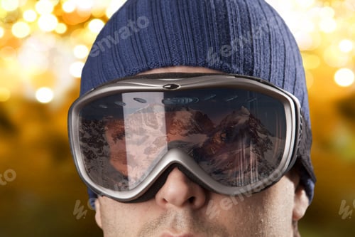 Preview: Skier Looking For A Snowy Mountain On A Yellow Lights Background.