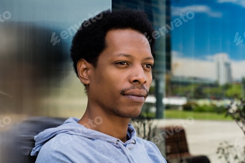 Preview: Portrait Of Young African American Man In Urban Background.
