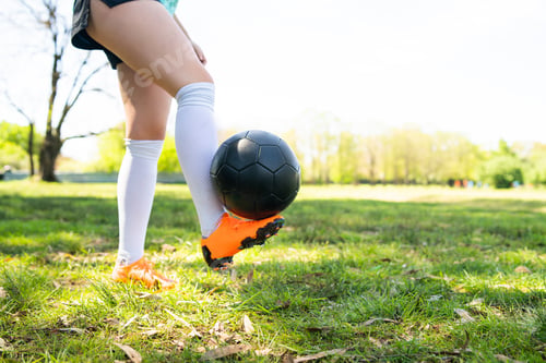 Preview: Young Woman Practicing Soccer Skills With Ball.