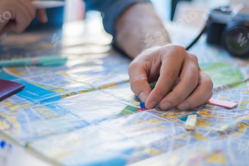 Preview: Young Man Planing A Trip. Hand On Pointing Blue Pin Plan To Travel On Map. Travel Concept.