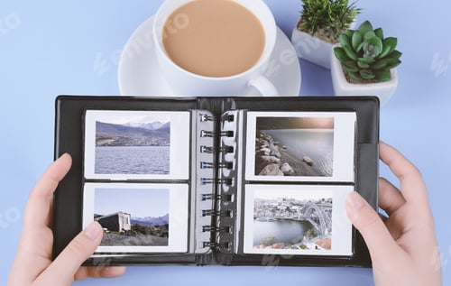 Preview: Photo Album With Instant Photos Of Landscapes On Light Blue Background. Travel Concept
