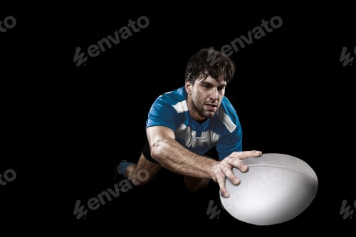 Preview: Rugby Player In A Blue Uniform. Black Background.