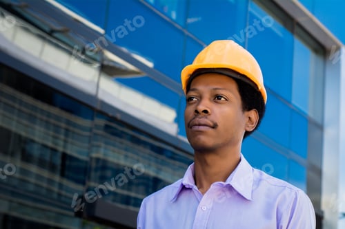 Preview: Portrait Of Afro American Engineer Developer In Hard Hat Outdoors.
