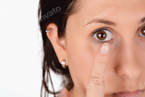 Preview: Closeup Of Female Face With Applying Contact Lens On Her Brown Eyes. Opthalmology Medicine Concept.