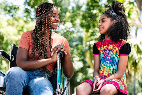 Preview: Woman In A Wheelchair At The Park With Her Daughter.