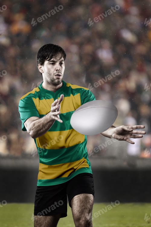 Preview: Rugby Player In A Green And Gold Uniform On A Stadium.