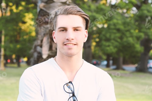 Preview: Portrait Of A Young Handsome Man With Glasses At The Park. Outdoors.
