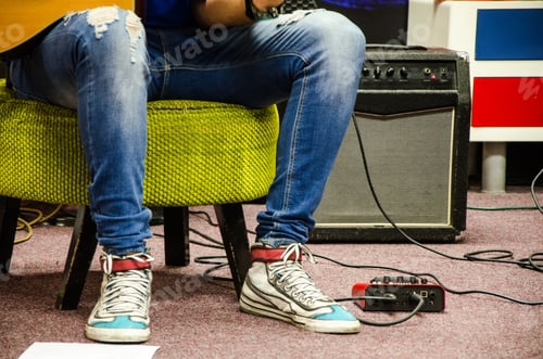 Preview: Close Up Of Man Playing Amplified Acoustic Guitar