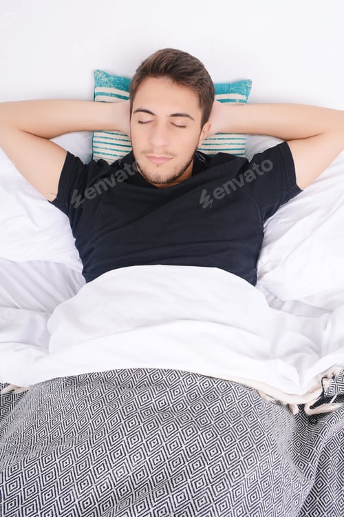 Preview: Close-Up Of Attractive Young Man Sleeping On Her Bed. Indoors.