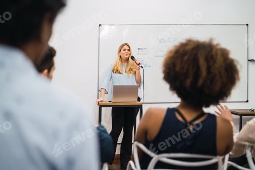 Preview: Friendly Business Woman Explaining Plan Of Work And Answering Questions On A Work Conference