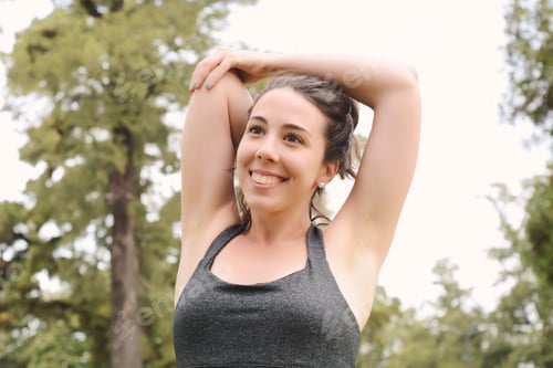 Preview: Portrair Of Young Beautiful Woman Doing Exercise At Park. Sport Concept. Outdoors