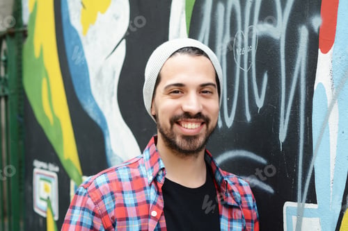 Preview: Portrait Of A Young Latin Man Against Colorful Wall. Outdoors. Urban Concept.