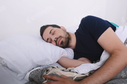 Preview: Close-Up Of Attractive Young Man Sleeping On Her Bed. Indoors.