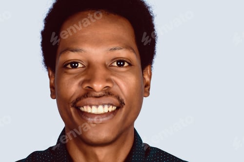 Preview: Portrait Of Afro American Man Looking At Camera On Studio.