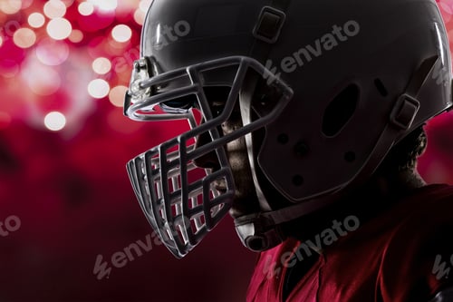 Preview: Close Up Of A Football Player With A Red Uniform On A Red Lights Background.