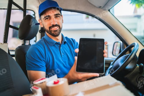 Preview: Portrait Of A Delivery Man Driver Using Digital Tablet While Sitting In Van. Delivery Service And