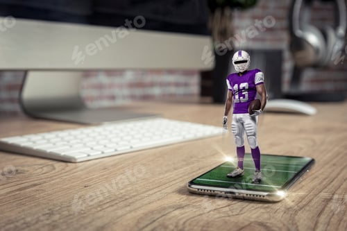 Preview: Football Player With A Purple Uniform Playing And Coming Out Of A Full Screen Phone On A Wooden