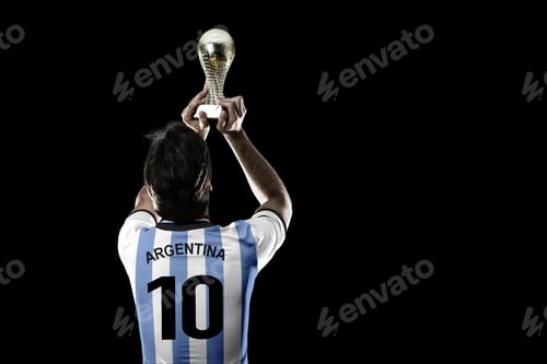 Preview: Argentinian Soccer Player, Celebrating The Championship With A Trophy In His Hand. On A Black