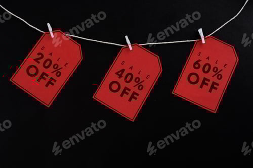 Preview: Sale Discount Tags Hanging by Clothespins on String