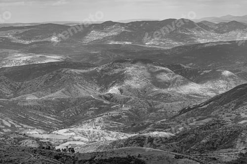 Preview: A Grayscale Shot Of Hills And Mountains