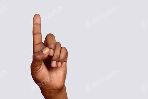 Preview: Close-Up Of Black Hand Pointing Up On Studio.