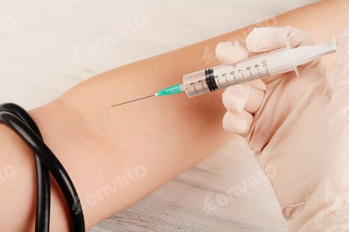Preview: Doctor Giving An Injection To A Patient. Healthcare And Medicine Concept