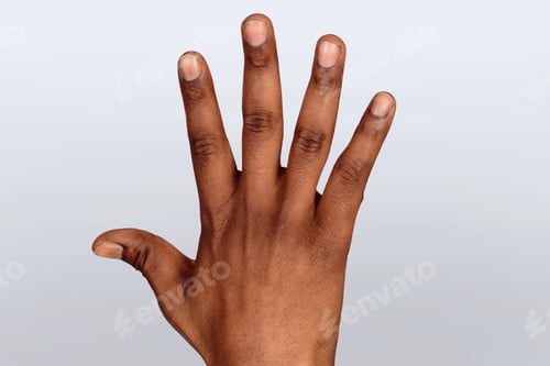 Preview: Close-Up Of An Open Black Palm On Studio.