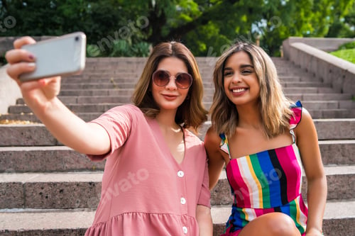 Preview: Two Friends Taking Selfie With Phone Outdoors.