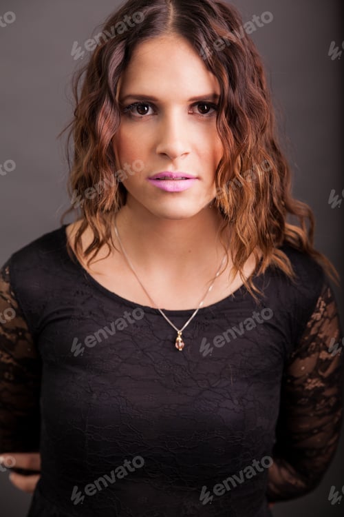 Preview: Studio Portrait Of A Young Latin Brunette Wearing A Black Dress