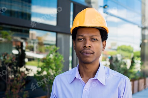 Preview: Portrait Of Afro American Engineer Developer In Hard Hat Outdoors.