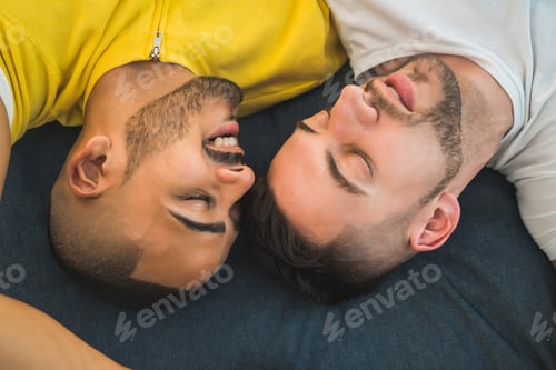 Preview: Portrait Of A Happy Gay Couple Spending Time And Laying Down On The Floor. Lgbt And Love Concept.