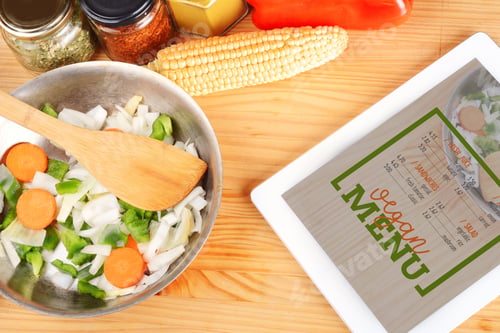 Preview: Vegetables And Seasonings For Cooking With A Digital Tablet On Wooden Table.
