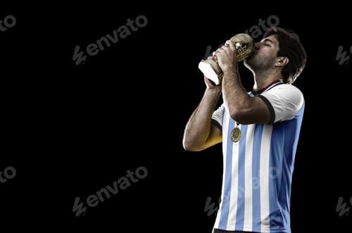 Preview: Argentinian Soccer Player, Celebrating The Championship With A Trophy In His Hand. On A Black