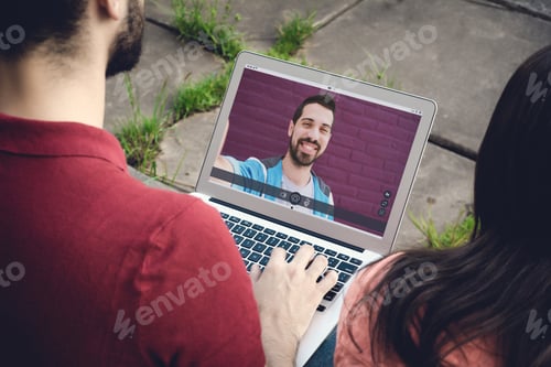 Preview: Closeup Of Man Chatting Online By Making Video Call On Laptop With Her Friend. Social Media