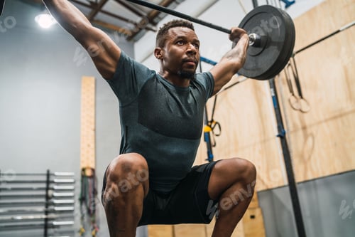 Preview: Portrait Of Young Crossfit Athlete Doing Exercise With A Barbell. Crossfit, Sport And Healthy