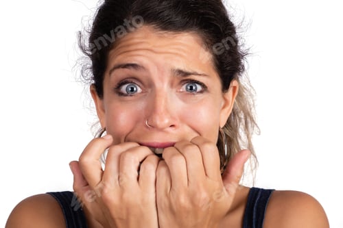 Preview: Portrait Of Young Woman Scared ,Afraid And Anxious Biting Her Finger Nails. Isolated White