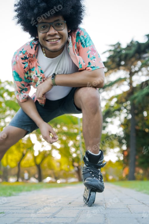 Preview: Latin Man Rollerskating On The Street.