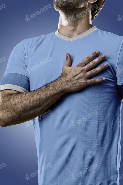 Preview: Uruguayan Soccer Player, Listening To The National Anthem With His Hand On His Chest. On A Blue