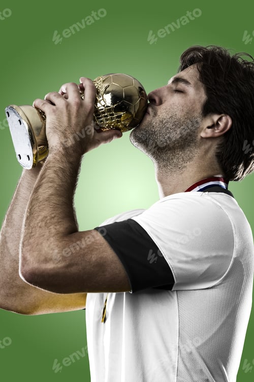 Preview: German Soccer Player, Celebrating The Championship With A Trophy In His Hand. On A Green Background.