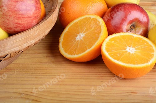 Preview: Basket With Different Fruits On Wooden Table. Healthy Eating Concept