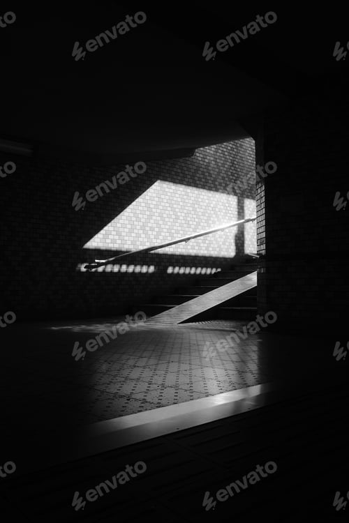 Preview: A Grayscale Shot Of A Staircase Of A Dark Underground Under The Sunlight