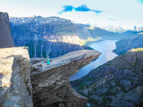 Preview: Girl In The Beautiful Dress On The Edge Of Cliff On Trolltung, Norway.