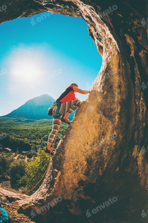 Preview: A Woman Trains On A Natural Rocks. The Girl Overcomes The Difficult Climbing Route On The Turkish