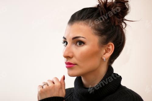 Preview: Profile of Woman with Brown Hair in Bun