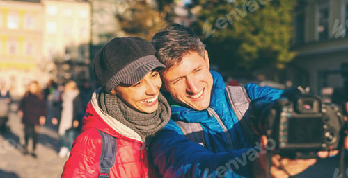 Preview: A Man And Woman Take A Selfie On Camera. Lovers Walk Around The City. Couple On The Old City